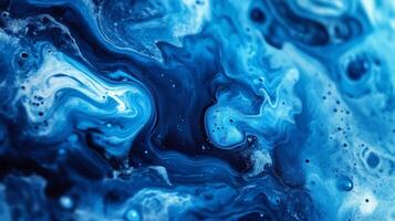 A mesmerizing abstract art piece with swirls of deep blues and vibrant whites, like an aerial view of the ocean with crashing waves. photo