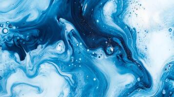 A stunning abstract background with swirling patterns of blue and white, like looking at liquid mixed together in an eye-catching way. photo