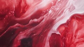 Abstract artwork with textures of mixed red and white. Fluid paints mix and merge, creating a marbled, textured surface in an organic way. photo