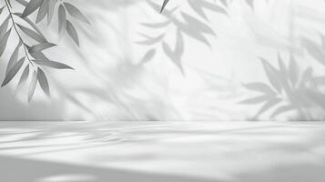 Minimalist display background with leaf shadows, ideal for showcasing products in a serene and calming atmosphere. Perfect for product photography. photo