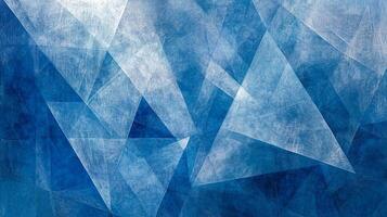 Abstract geometric background in shades of blue, featuring overlapping triangles with a subtle texture and a modern, artistic design. photo