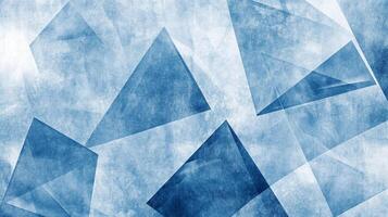 Abstract art featuring overlapping triangles with a cool blue color palette and a textured surface, creating a visually interesting pattern. photo