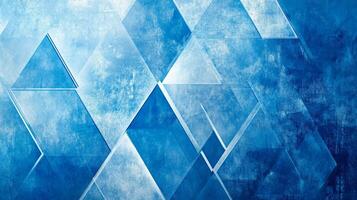 Abstract blue geometric background with triangles and diamond shapes arranged in a modern and textured pattern for contemporary design. photo