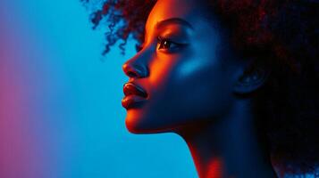 Portrait of a woman with a vibrant and colorful lighting scheme emphasizing her features. Elegant, glowing skin, and a strong profile. photo