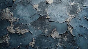 Cracked blue wall with peeling plaster, exposing texture and age. A weathered surface showing decay and unique patterns. photo