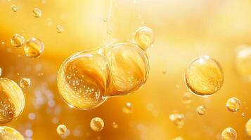 Two large bubbles of liquid, one of which is yellow. The bubbles are floating in the air, creating a sense of lightness and playfulness photo