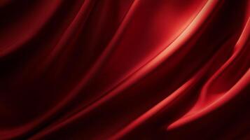 Lush red fabric drapes in smooth, elegant folds, catching the light with depth and sophistication. A touch of drama, class and elegance. photo