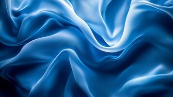 Abstract blue flowing fabric with soft, light reflections, creating smooth, elegant waves and folds with depth and dimension. photo
