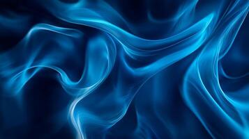 Abstract image of blue smoke or waves. The interplay of light and shadow creates a sense of depth and motion, with flowing lines and curves. photo