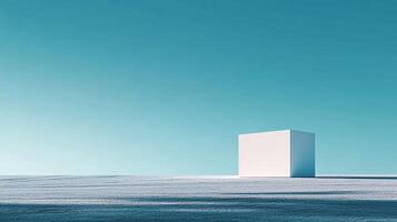 Minimalist composition featuring a pristine white cube on a textured surface against a serene, gradient blue background. Serenity and geometry meet. photo