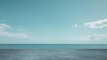 Serene ocean vista with a calm sea meeting a clear sky, creating a peaceful and expansive scene from a concrete platform. photo