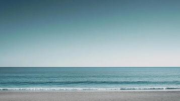 Minimalist seascape featuring a tranquil ocean meeting the shore under a soft, gradient sky, evoking peace and serenity. Calm ocean. photo
