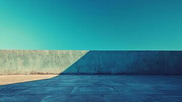 Minimalist scene with a stark contrast between the vivid sky and a geometric interplay of shadows on a concrete surface. Tranquil and balanced. photo