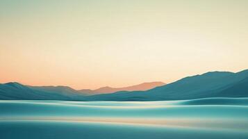 Abstract landscape with serene teal foreground and distant mountains under a soft, gradient sky at dawn or dusk creates a tranquil scene. photo