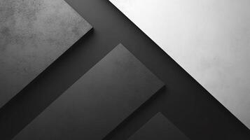Geometric abstraction featuring intersecting planes of gray, black, and white textures, creating depth and visual interest. photo