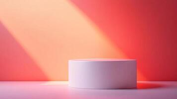 Minimalist presentation scene showcasing a white cylindrical platform against a red backdrop with soft, natural light creating a spotlight effect. photo