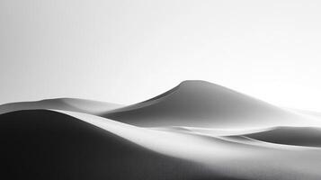Abstract grayscale landscape of rolling desert sand dunes under a bright sky. Soft shadows create depth and add to the serene mood. photo