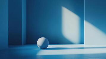 A minimalist, geometric scene featuring a white sphere in a blue room with strong light and shadow, creating a sense of depth and serenity. photo