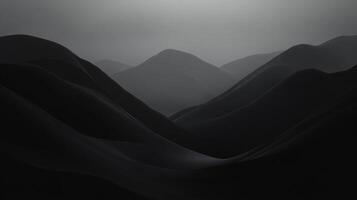 Monochromatic landscape featuring a series of rolling hills under a hazy sky, creating a serene and mysterious ambiance. photo