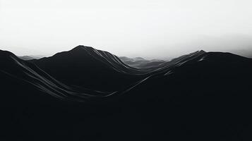 Monochromatic landscape featuring dark mountain ridges receding into the horizon under a bright sky, creating a sense of depth and vastness. photo