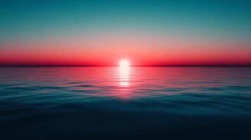A radiant sun breaks the horizon, casting a fiery glow on the tranquil waters, painting the sky in shades of red and blue. photo