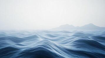 Ocean expanse with gentle waves, distant land, and a serene, misty sky, creating a sense of tranquility and vastness. photo