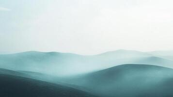 A serene view of rolling hills fades into the misty distance, creating a calming and ethereal landscape with soft, diffused lighting. photo