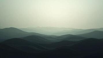 Hazy mountain range stretching into the distance. Overlapping ridges create depth, soft light and cool color evoke tranquility. photo