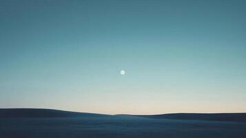 Serene landscape with a full moon shining brightly over a dark field. The night sky is a calming gradient of blue and cyan. photo