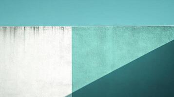 Geometric wall texture in aqua and white tones with a diagonal shadow creating a minimalist and modern aesthetic. Abstract background photo