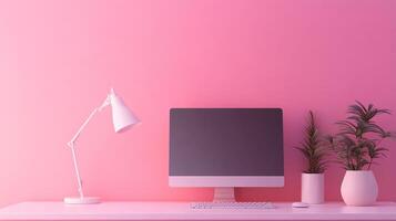 Monochromatic pink workspace featuring computer, lamp, and plants creating a serene and modern aesthetic for focused work. photo