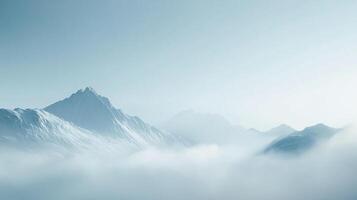 Majestic snow-capped mountains rise through a sea of soft, ethereal clouds, creating a serene and awe-inspiring landscape. photo