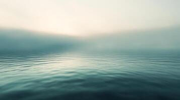 A serene view of the sea, where the water meets the sky in a seamless blend of soft hues and calming tranquility, creating a peaceful vista. photo