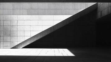 Monochrome architectural study of light and shadow revealing geometric patterns and concrete textures in an open space. Modern design. photo