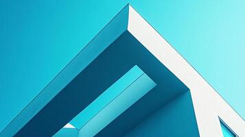 Angular architecture intersects with a vibrant sky, casting shadows that emphasize the building's geometric design against the blue backdrop. photo