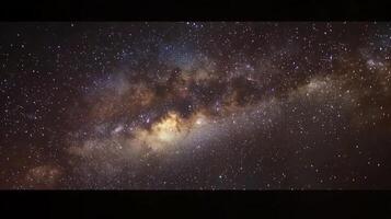 Vibrant display of stars and cosmic dust in the Milky Way. The night sky explodes in vivid colors under the dark abyss. photo