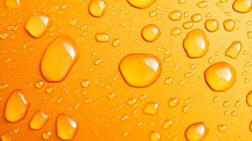 A vibrant, close-up shot showcases water droplets on a solid orange background. The droplets vary in sizes, creating a visually appealing texture. photo