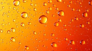 Water droplets clinging to a surface, creating a mesmerizing abstract pattern with golden amber hues reflecting light and texture. photo