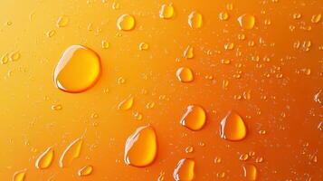 Captured is an abstract and visually intriguing image of vibrant, orange water droplets, varying in size, scattered across a surface. photo