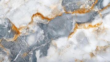 Striking marble slab featuring a dynamic blend of white, grey, and gold veining creating a luxurious and unique aesthetic. photo
