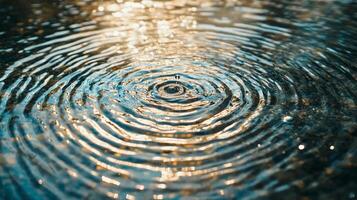 Water drop impact creates concentric rings. Surface tension displays the ripple effect on a body of calm water. Sunlight reflects subtly. photo