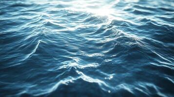Sunlight dances on the deep blue ocean, creating a mesmerizing display of light and shadow across gentle waves. A captivating seascape. photo