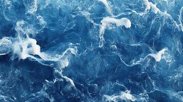 Aerial view showcases the mesmerizing textures of deep blue water with foam, creating a dynamic and visually stunning aquatic landscape. photo