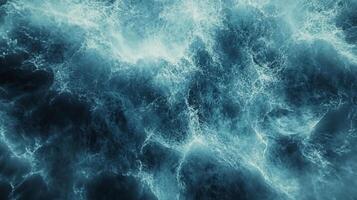 Aerial view showcases dynamic ocean waves, capturing the power and movement of water in a mesmerizing display of natural patterns. photo