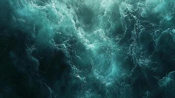 Aerial view of ocean waves crashing, the rhythmic dance of water is captured in a breathtaking scene. The deep blue of the ocean dominates. photo