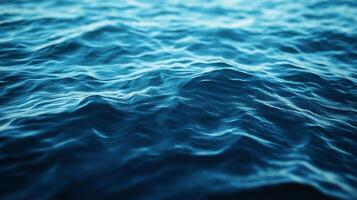 Serene ocean waves glimmering under sunlight, reflecting the sky with their varying blue hues and gentle ripple patterns. photo