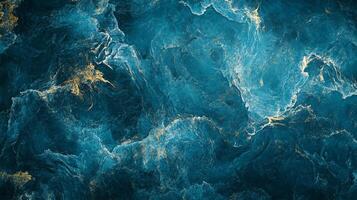 Abstract artwork showcasing a turbulent mix of dark blues and shimmering gold, creating a dynamic, fluid texture. photo