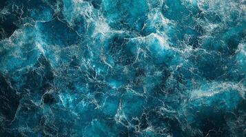 Captivating aerial view showcasing vibrant, swirling patterns in the deep blue ocean, creating a dynamic and mesmerizing aquatic scene. photo