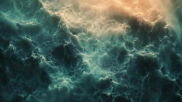 Abstract waves with foamy texture in deep blue tones, contrasted by a soft gradient to light orange above, offering a unique visual. photo