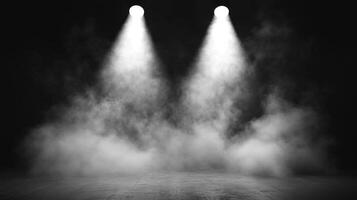 A dramatic black and white stage scene with two spotlights shining down through a layer of smoke and fog, highlighting the center stage area. photo